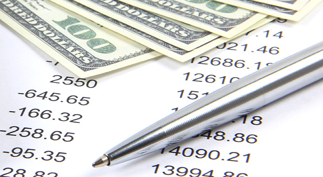 Photo: Pen and Money on Paper